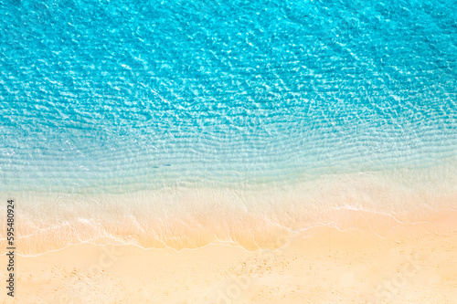 Relaxing aerial beach, vivid summer vacation tropical Mediterranean landscape banner. Waves surf amazing blue ocean lagoon, sea shore coastline. Beautiful aerial drone top view. Peaceful beach seaside