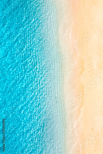 Relaxing aerial beach, vivid summer vacation tropical Mediterranean landscape banner. Waves surf amazing blue ocean lagoon, sea shore coastline. Beautiful aerial drone top view. Peaceful beach seaside