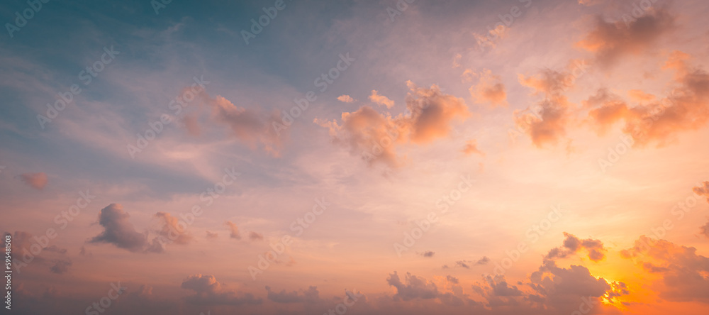 Fototapeta premium Beautiful sunset sky above clouds with dramatic light. Beautiful sunset sky. Nature sky backgrounds, majestic sunrise sundown sky background with gentle colorful clouds
