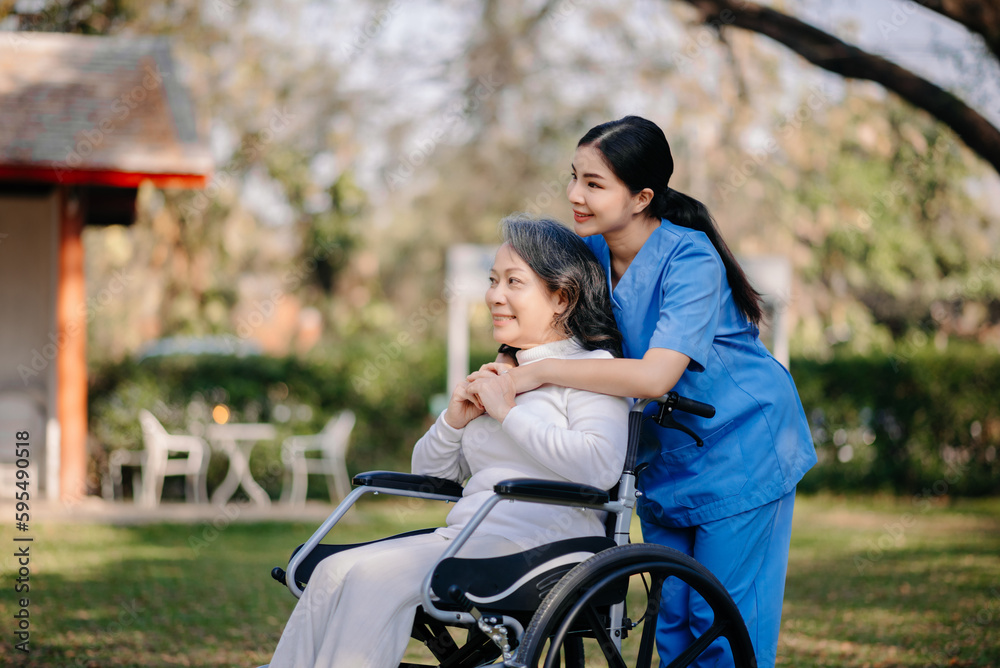 Elderly asian senior woman on wheelchair with Asian careful caregiver. Elderly asian senior woman on wheelchair with Asian careful caregiver.
