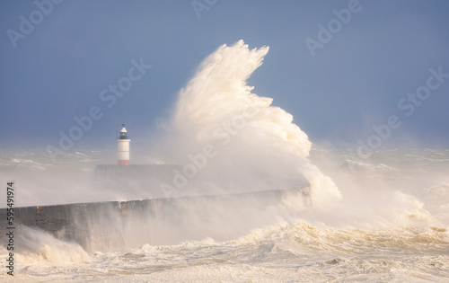 Storm Noa and crashing waves at Newhaven lighthouse and seawall on the East Sussex coast south east England © SuxxesPhoto