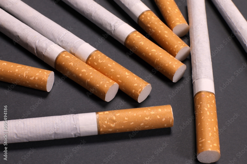Background from cigarettes on a gray background Background from cigarettes on a gray background