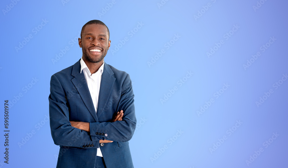 Confident African businessman with crossed arms, blue