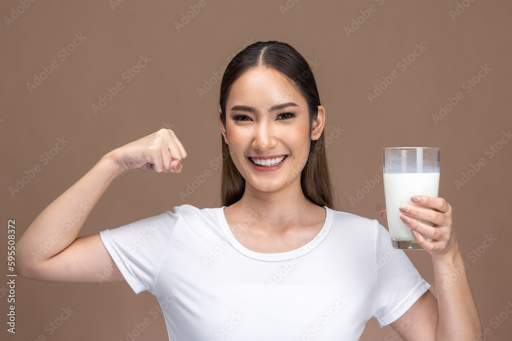 Asian beauty woman cute girl feel happy drinking milk for good health Happiness on Beige background. Asian beauty woman cute girl feel happy drinking milk for good health Happiness on Beige background.
