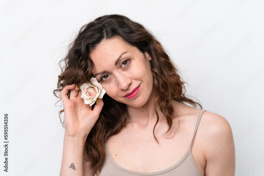 Young caucasian woman isolated on white background holding flowers. Close up portrait Young caucasian woman isolated on white background holding flowers. Close up portrait