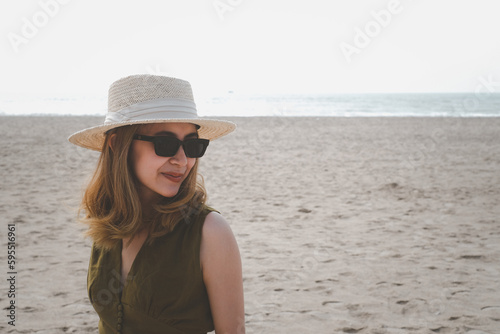 young beautiful woman happy on sunset beach  playful  running  indie style  summer vacation and having fun. positive mood romantic.