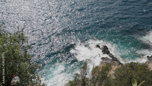 Azure waves of mediterranean sea splashing on French Riviera coast