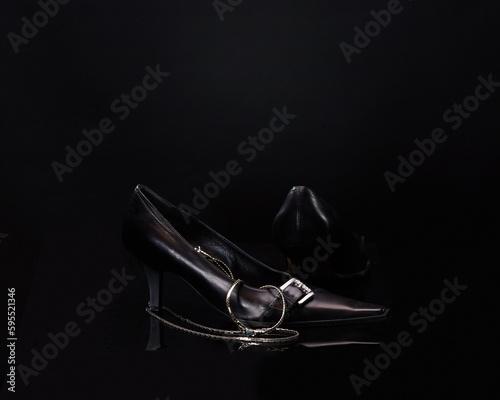 Women's model shoes with a necklace