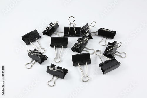 a set of black papper clips on an isolated white background