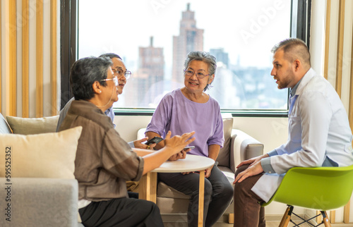 Man doctor with stethoscope service help support discussing and consulting care talk to sick senior asian woman patient in hospital,caregiver,elderly,recovery,illness insurance.healthcare and medicine
