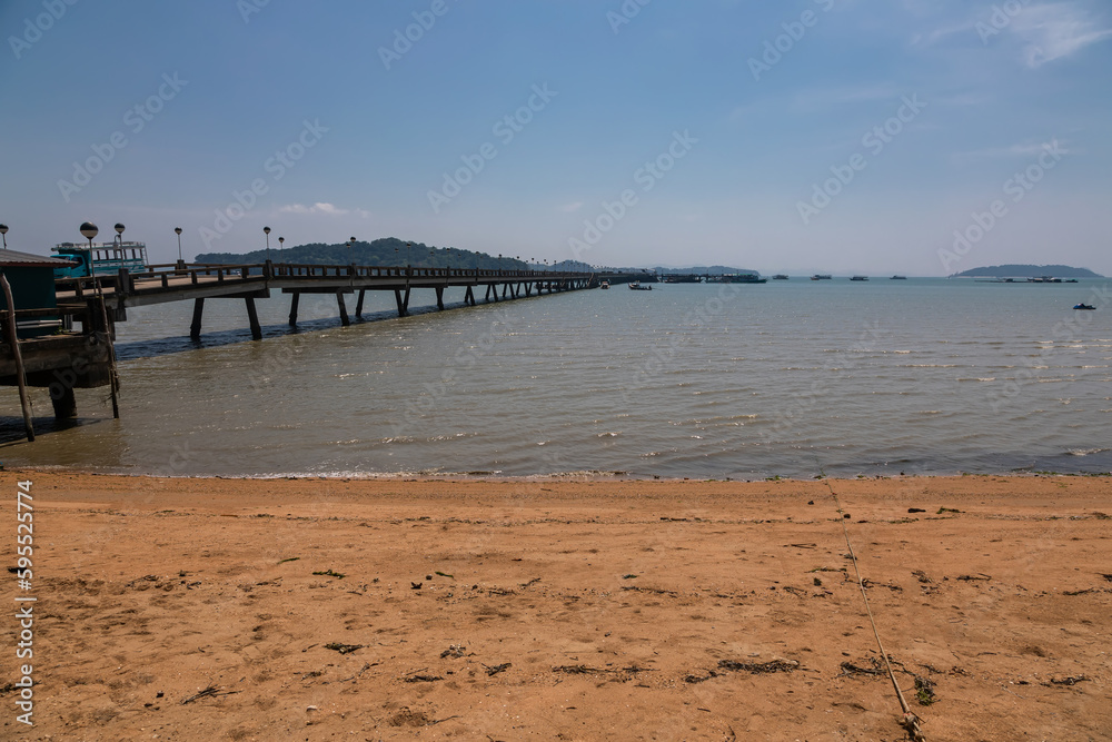 Beautiful and long sandy beach. Sunny morning. Green palms. Beautiful sea.