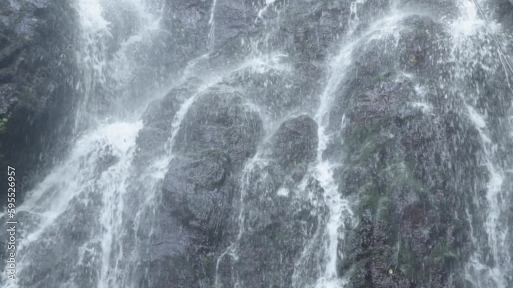 waterfall in the mountains in the forest close-up waterfall in the mountains in the forest close-up