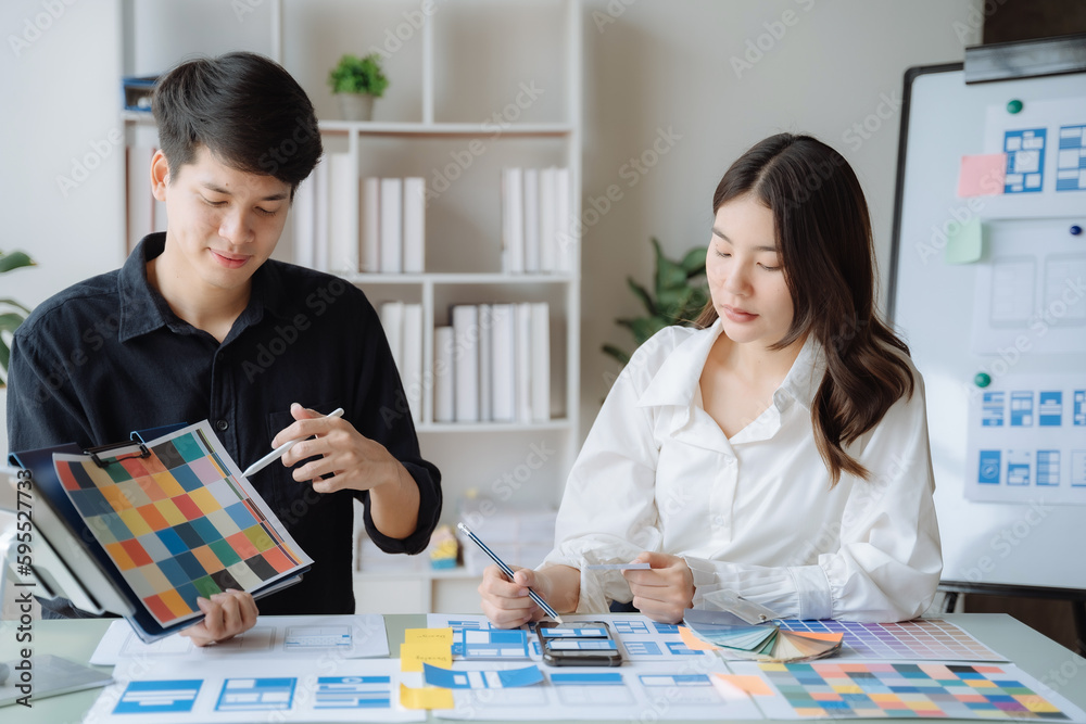 Fototapeta premium Creative team web designer planning application development for web mobile phone at modern workplace.