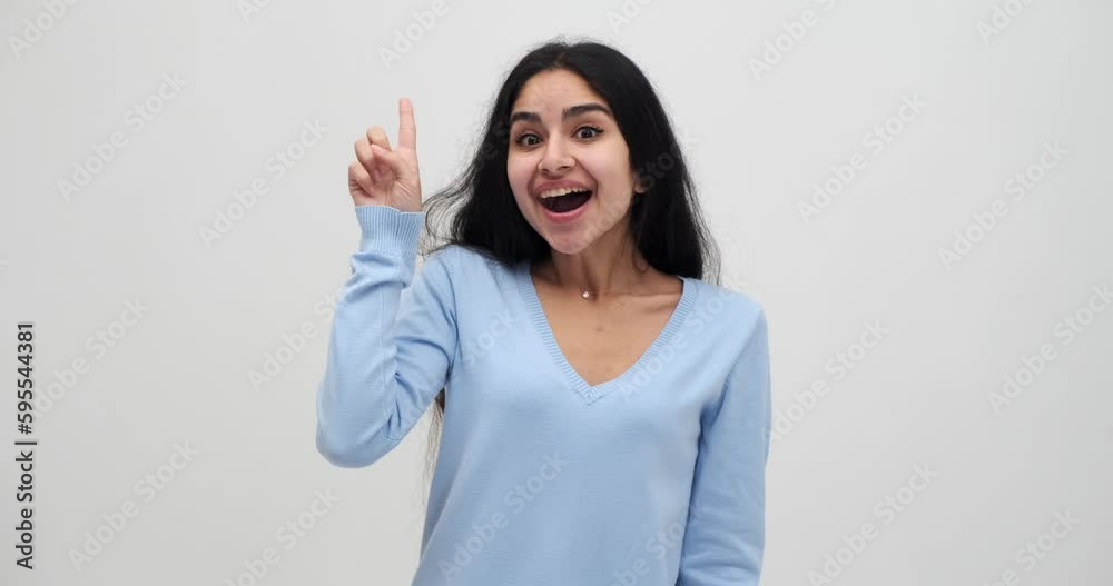 Excited woman pointing finger up with successful idea Excited woman pointing finger up with successful idea