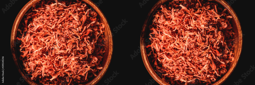 Fototapeta premium Dried carrots in wooden plate for cooking. Vegetable drying in dehydrator. Healthy and healthy food. Banner.