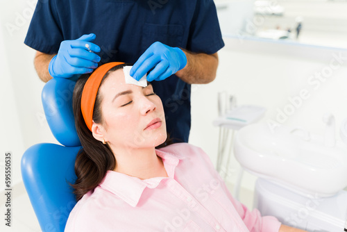 Attractive woman at the beauty clinic getting a cosmetic procedure