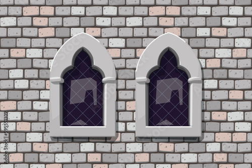 medieval windows on grey color stone wall