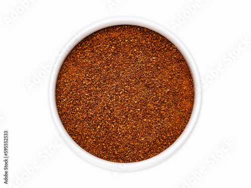 Coconut sugar close-up in a white cup on a white background, top view, flat lay, isolate. Nectar of coconut flowers.
