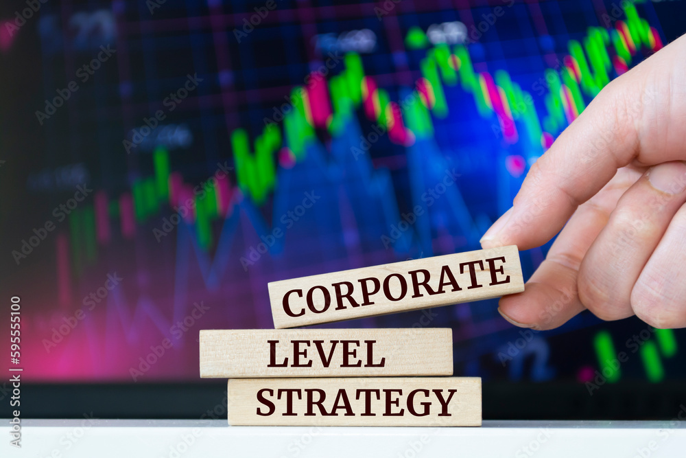 Naklejka premium Wooden blocks with words 'corporate level strategy'. Business concept