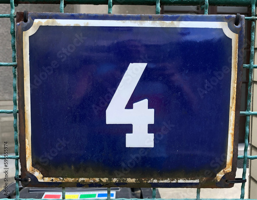 Blue metal sign with the number 4