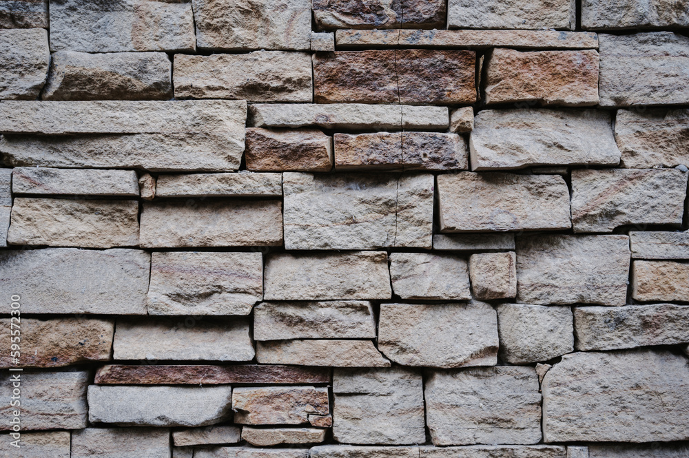 The texture of old stone or clay bricks. Masonry walls of an old building.