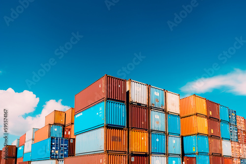 Shipping containers stacked against blue sky. Generative ai