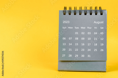 The August 2023 desk calendar for 2023 year on yellow color background.