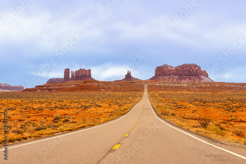 View of Monument Valley from Forrest Gump Point ( US-163 ). Scenic road in the desert with Red Rocky Mountains in Background. Forrest Gump Point in Oljato-Monument Valley, Utah, United States.