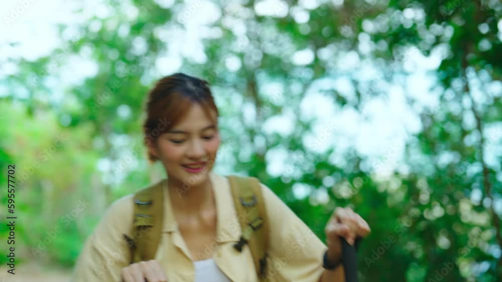 Beautiful asian woman walking at forest alone. She enjoying with backpack or camping trip alone. Beautiful asian woman walking at forest alone. She enjoying with backpack or camping trip alone.