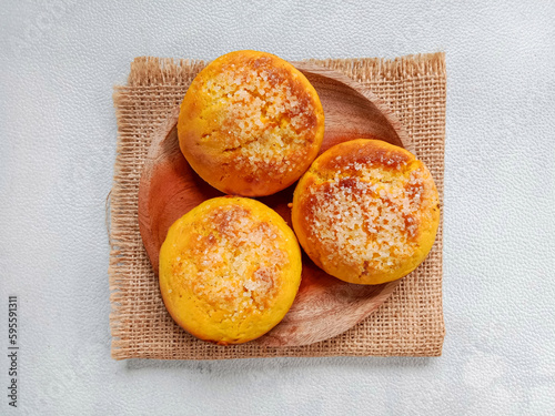 Ruti kuning or yellow bread. Belitung local sweet bread topped with sugar. Made from wheat flour, coconut milk, egg and sugar.