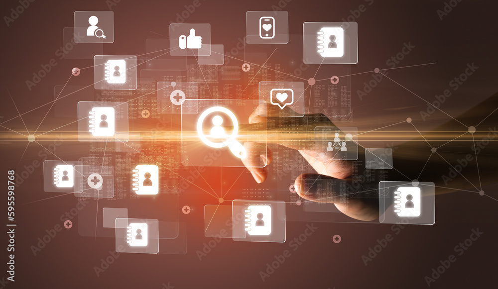 Hand pressing social media multimedia application screen with media icons on futuristic concept Hand pressing social media multimedia application screen with media icons on futuristic concept