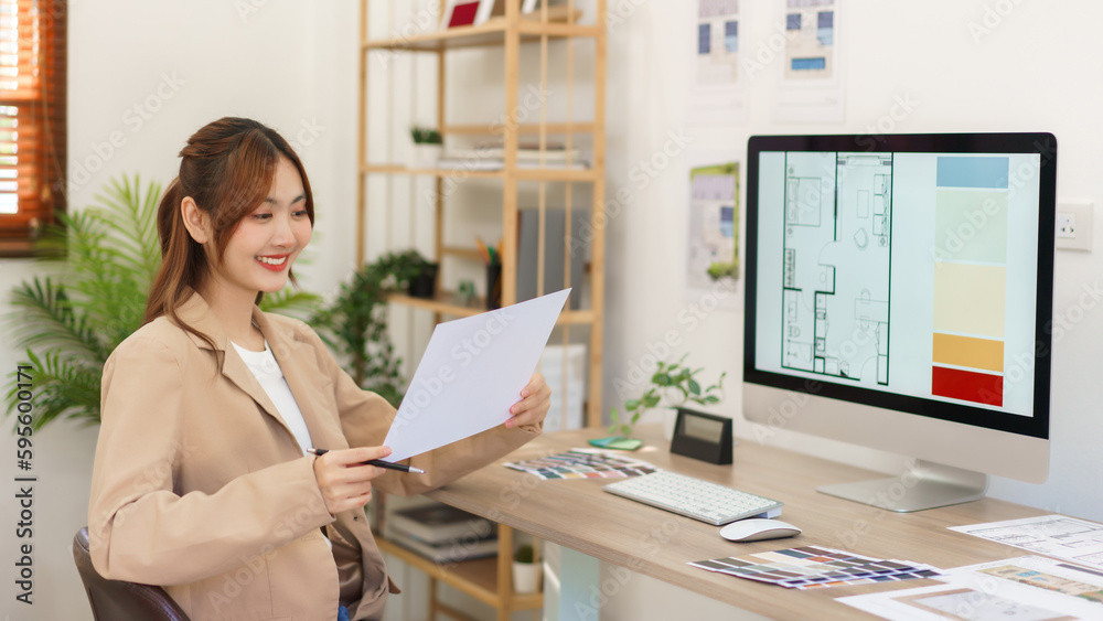 Architecture concept, Female architect holding blueprint and checking of designing house interior Architecture concept, Female architect holding blueprint and checking of designing house interior