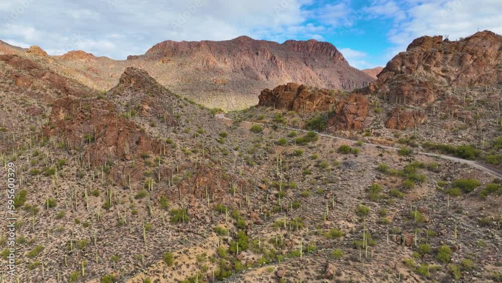 Gates Pass Road aerial view in Tucson Mountains with Sonoran Desert landscape from Gates Pass near Saguaro National Park in city of Tucson, Arizona AZ, USA. Gates Pass Road aerial view in Tucson Mountains with Sonoran Desert landscape from Gates Pass near Saguaro National Park in city of Tucson, Arizona AZ, USA.