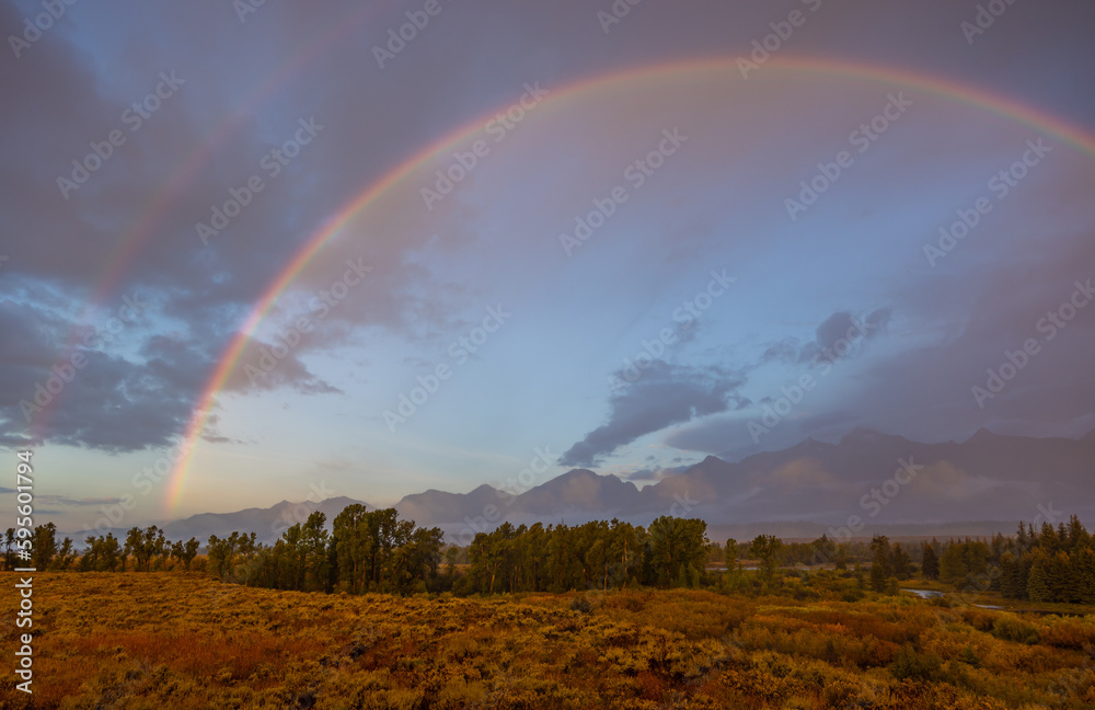 Naklejka premium Autumn Landscape in the Tetons in a Storm with Rainbow