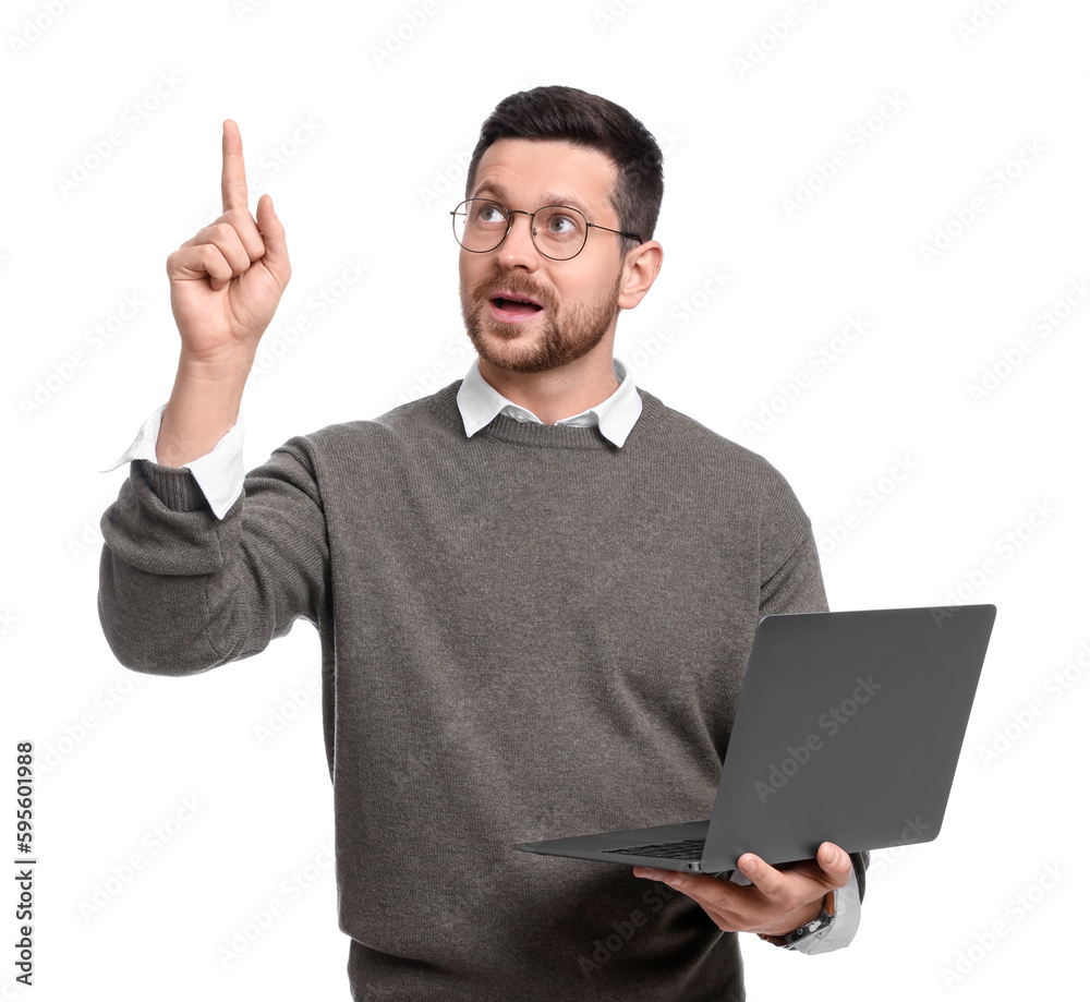 Handsome bearded businessman with laptop pointing at something on white background Handsome bearded businessman with laptop pointing at something on white background