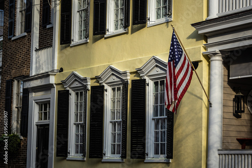 An American flag hanging outside of a colonial era home in Charleston, South Carolina.