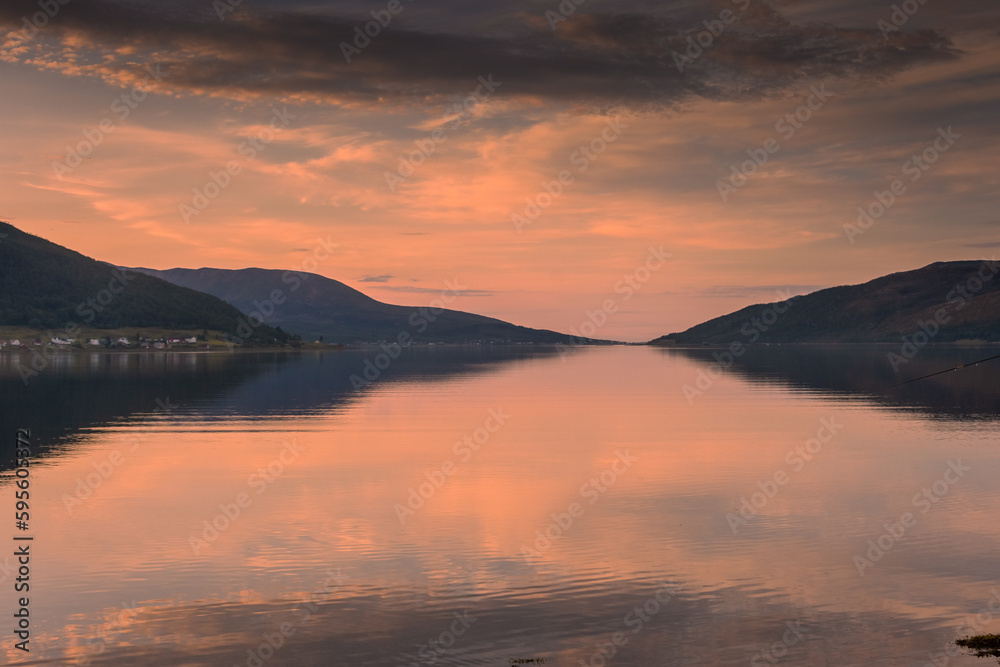 Beautiful sunset over a lake in Senja Island, Norway Beautiful sunset over a lake in Senja Island, Norway