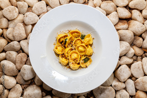 Italian Capelletti meal close up rock background