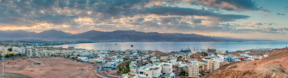 Panorama.  Morning aerial view on the Red Sea. Scenic landscape with surrounding mountains and buildings of Eilat (Israel) and Aqaba (Jordan) cities. 