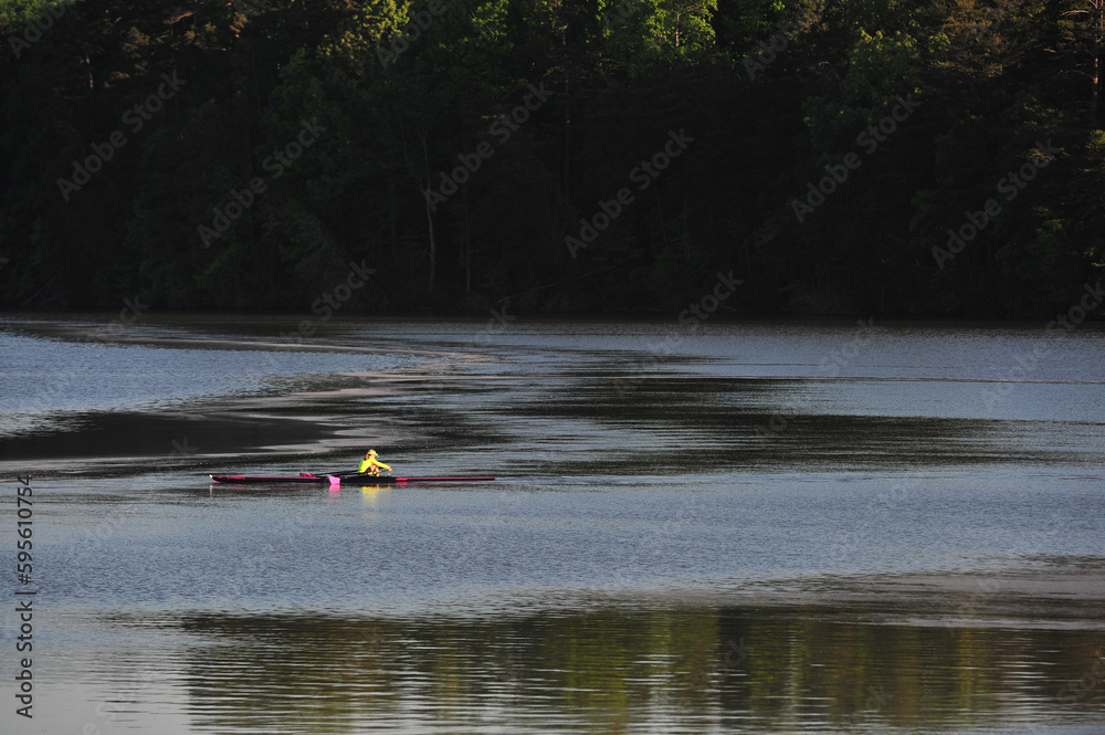 Fototapeta premium Early morning rowing club on lake