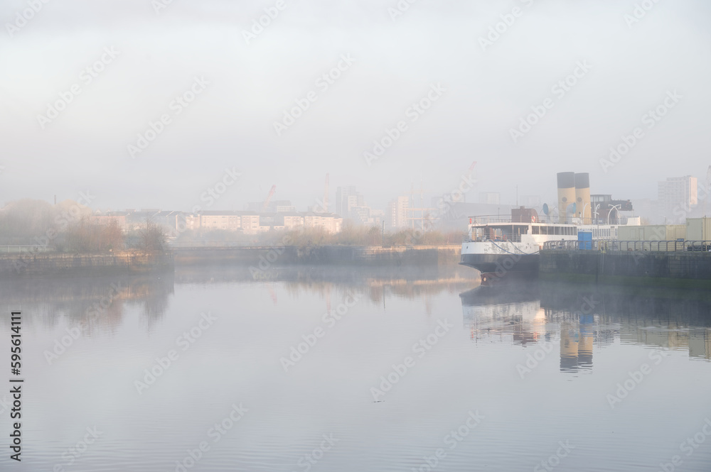Steamboat moored on the River Clyde and construction activity in background Steamboat moored on the River Clyde and construction activity in background