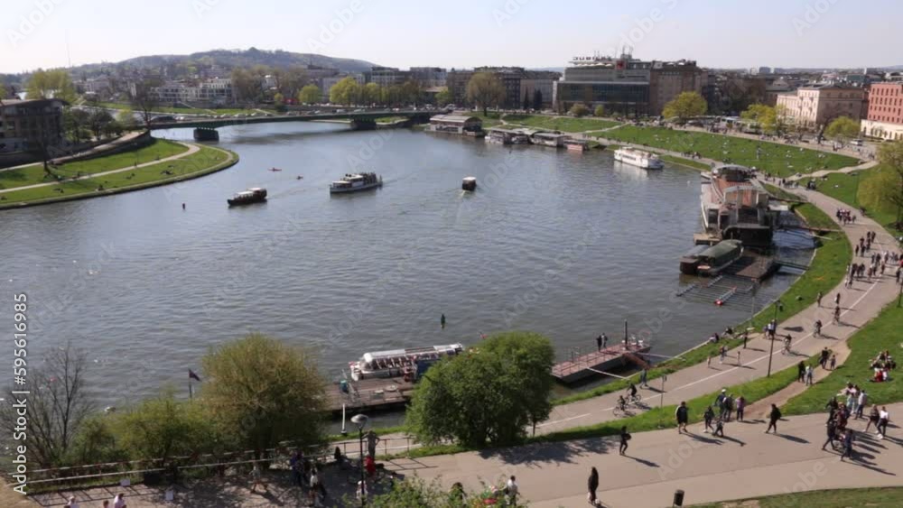 Pleasure boats cruise on Vistula River in Cracow, Poland. Pleasure boats cruise on Vistula River in Cracow, Poland.