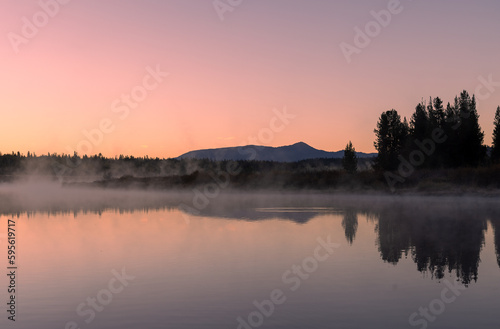 Beautiful Sunrise Landscape Reflection in the Tetons in Autumn