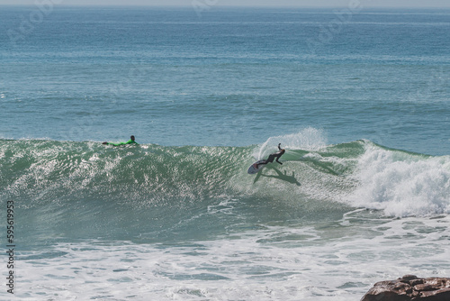 Photography Surfer generating spray in Anchor Point, Morroco
