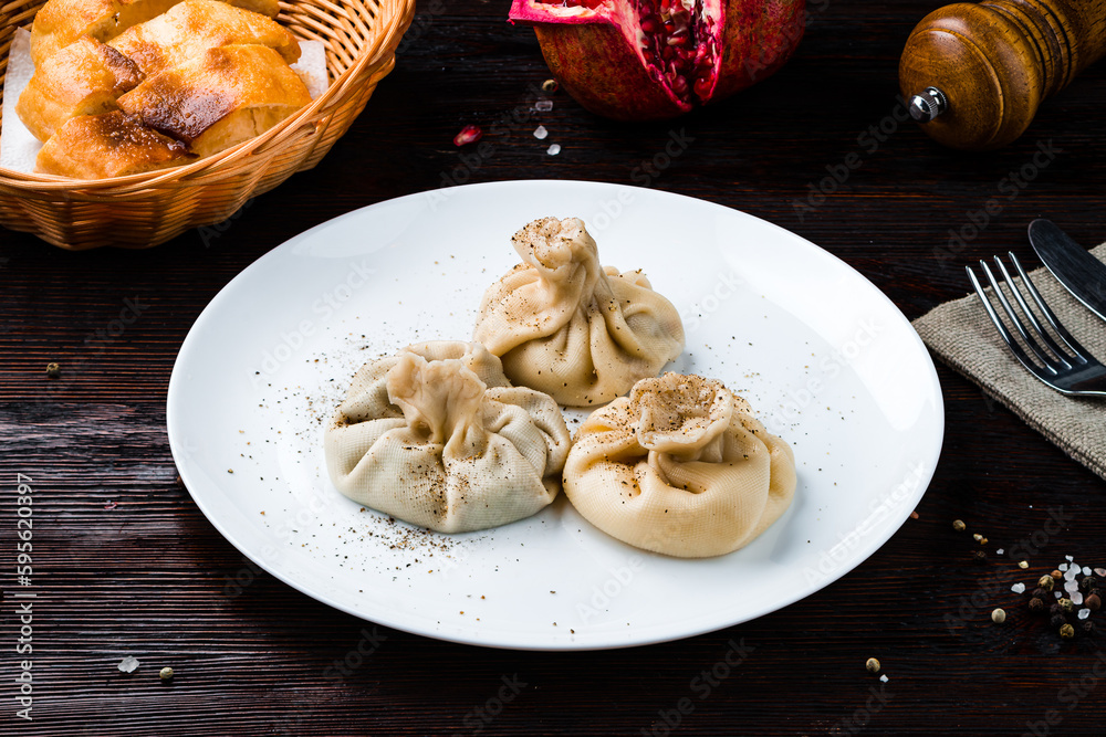 Asian kitchen manti with meat, pepper and bread.