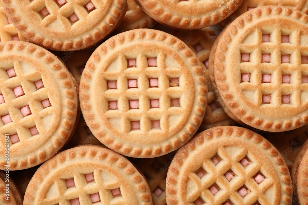 Tasty sandwich cookies with cream as background, top view Tasty sandwich cookies with cream as background, top view