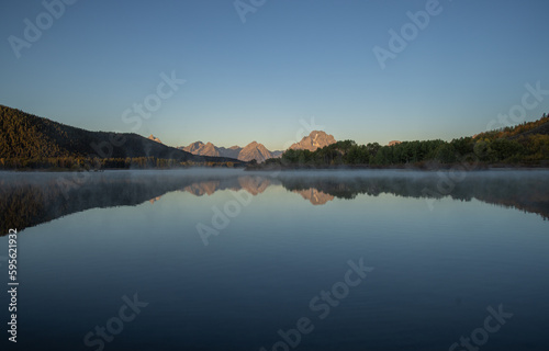 Beautiful Sunrise Landscape Reflection in the Tetons in Autumn