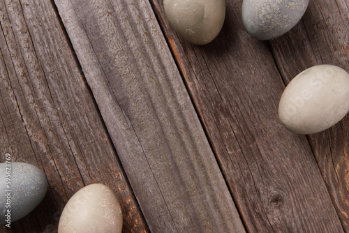 Eggs dyed with natural dyes on wooden background. Easter celebration concept