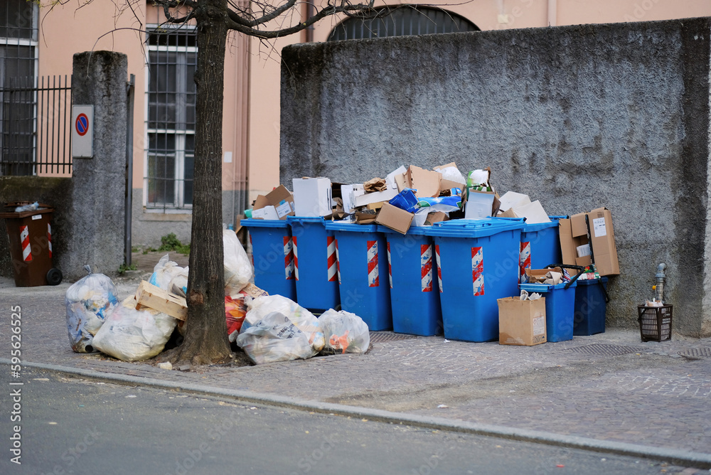 Photo of the street full of garbage of different types. Urban pollution