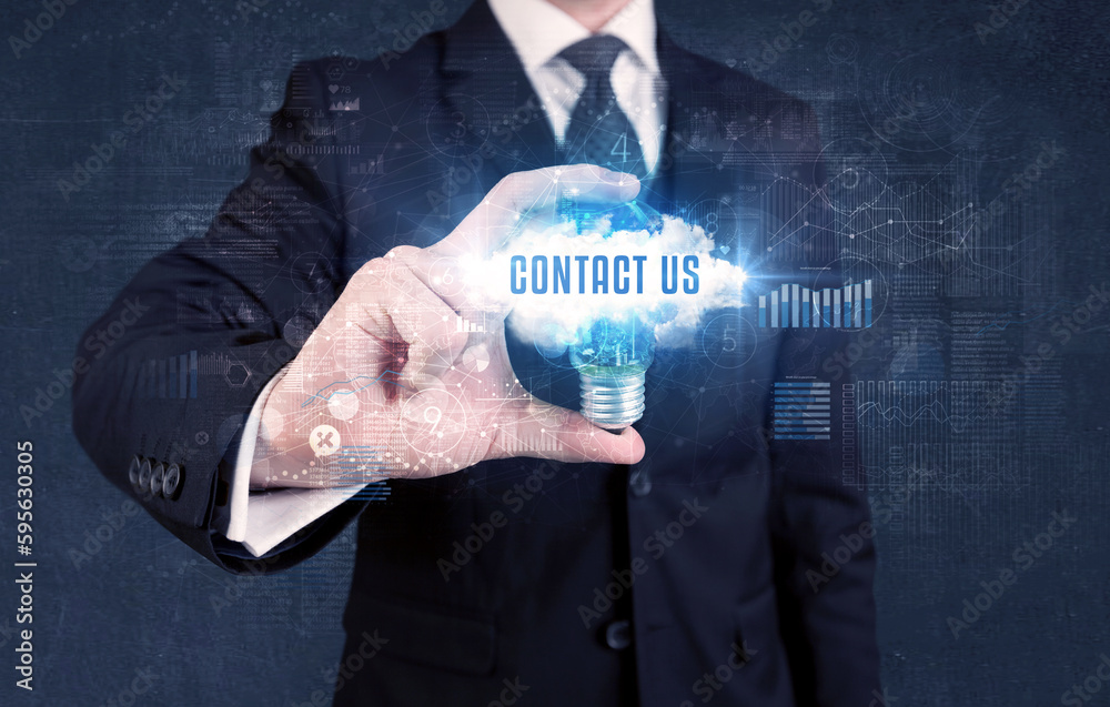 Businessman holding a light bulb, business concept Businessman holding a light bulb, business concept